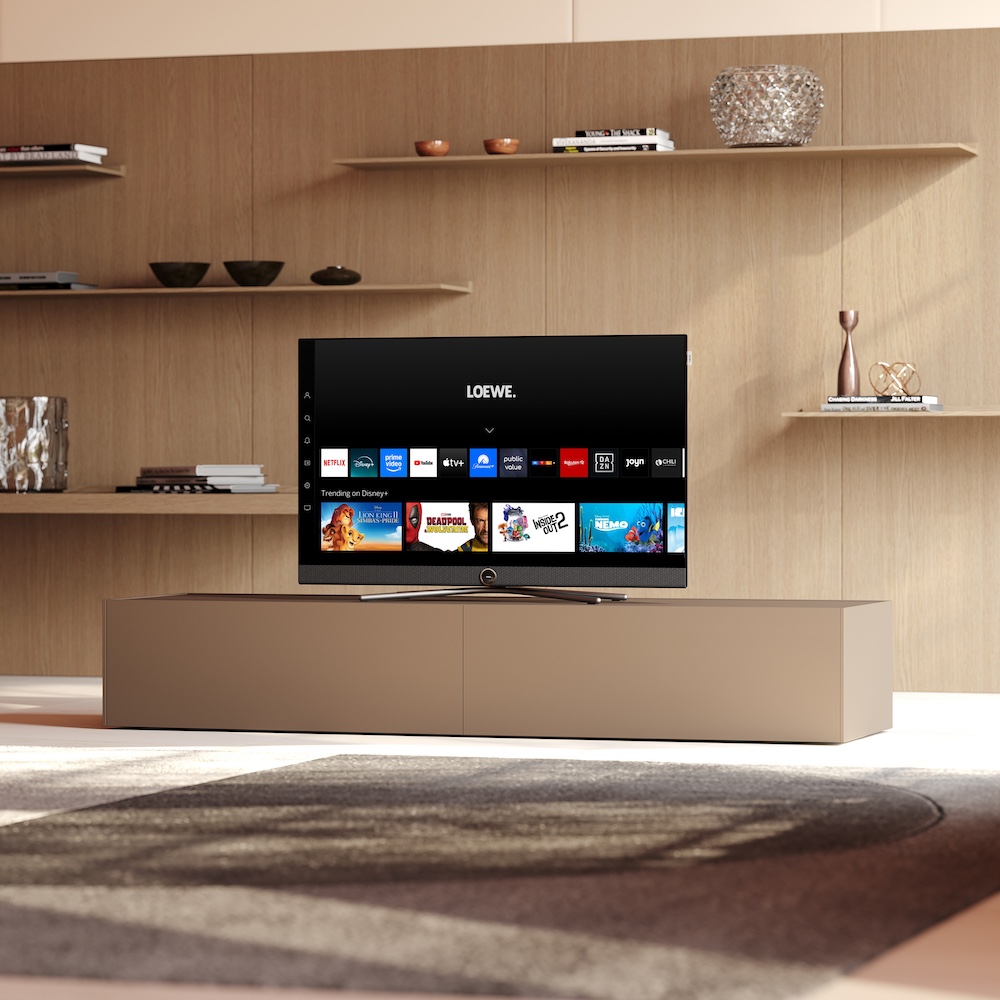 Loewe Callas TV in modern living room showing streaming apps