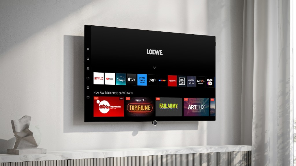 Loewe Inspire OLED TV wall-mounted showing streaming home screen
