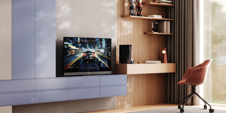 Loewe We.SEE TV wall-mounted in modern bedroom with gaming